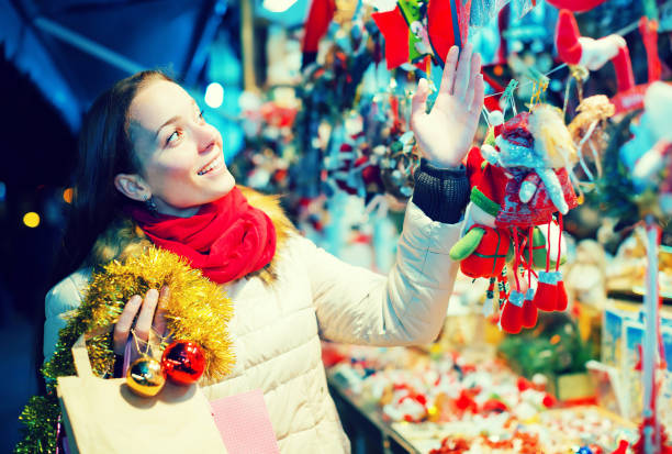 istock Woman at Christmas fair in evening 692889046