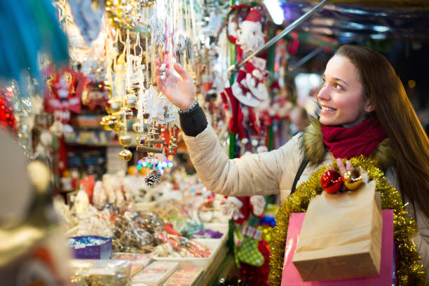 istock Woman at Christmas fair in evening 692889190