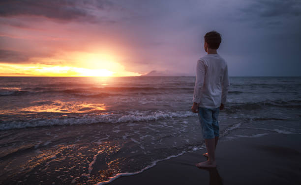 Watching beautiful sunset near sea