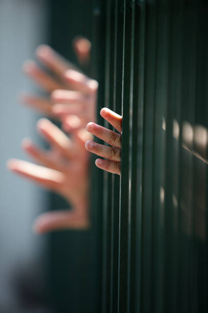 children hand in jail