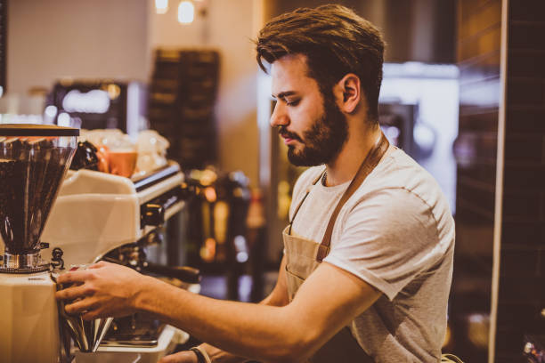 istock Young barista is making a coffee in cafe shop 692891616