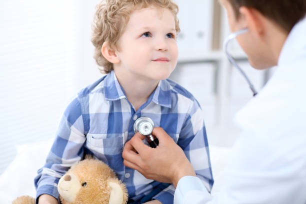 istock Doctor examining a child  patient by stethoscope 692891706