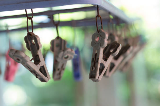 istock Clothes pegs or clothespins hang on a cord 692892108