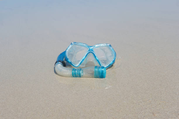 istock Blue Snorkel on the beach. 692892480