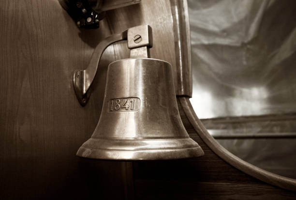 istock Ship bell on a magnificent naval vessel 692892500