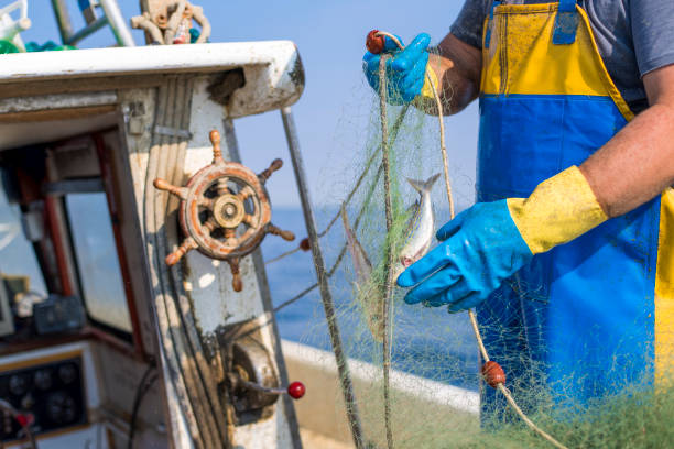 Fisherman working on his fishing boat
