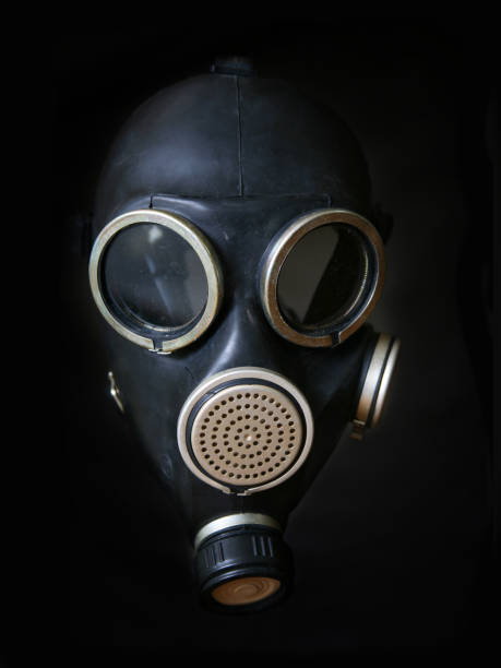 istock Unmodern gas mask on a black background 692892798