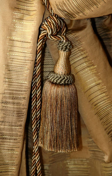 istock Brush and cord on a brown portiere 692897152