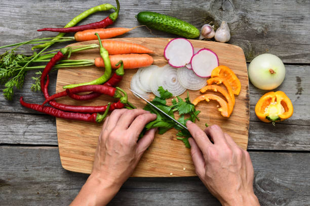 istock Vegetables for salad. Vegetable marrows, pepper, onions, parsley. 692901500