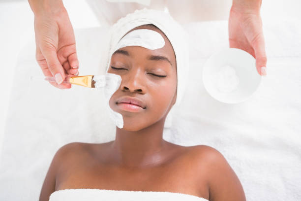 istock Pretty woman getting a facial treatment 692901890