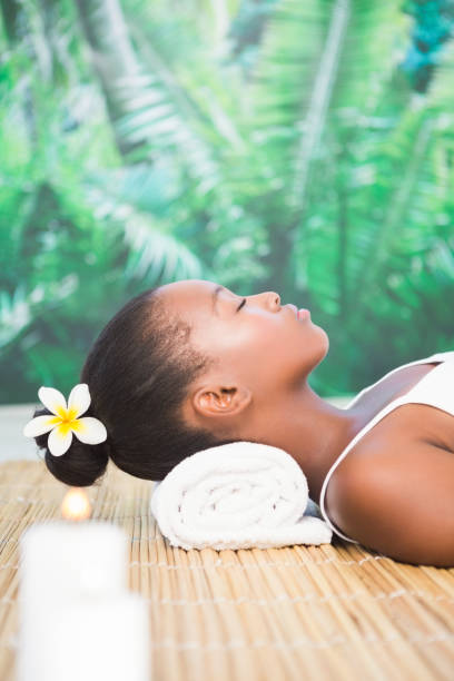 istock Side view of a beautiful woman on massage table 692905354