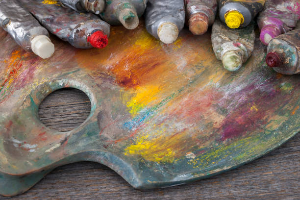 istock Artist's palette and tubes with paint 692905538