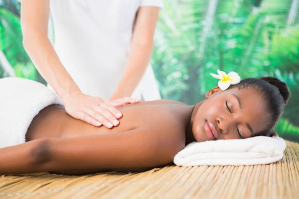 istock Pretty woman enjoying a back massage 692908586