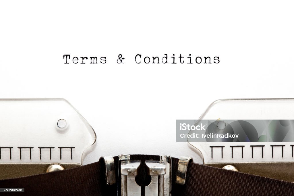 Terms And Conditions On Typewriter Terms and Conditions headline printed on old typewriter. Contract Stock Photo