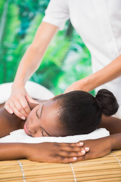 istock Pretty woman enjoying a back massage 692909688