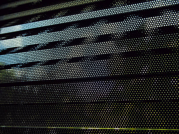 istock Many small eyelet on black metallic blinds 692925456