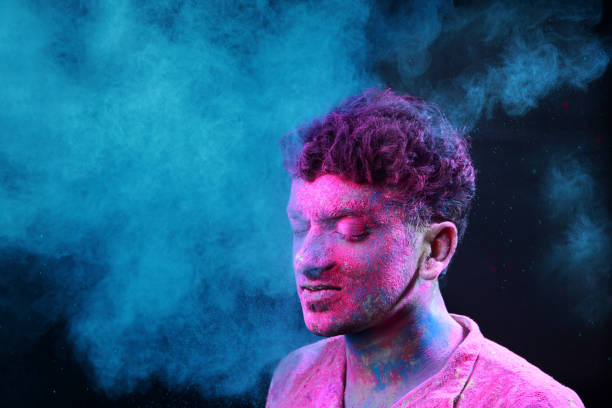 istock Young man plays Indian festival Holi 692925520