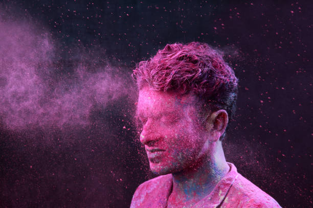 istock Young man plays Indian festival Holi 692925608