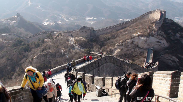 Great Wall Of China Badaling Section,People Walking Up And Down Steps Scene In Beijing China.Asia Scenery Of Lots Of People Walking Up And Down Steps Of Great Wall Of China Badaling Section During The Winter Season In Beijing China.East Asia badaling stock pictures, royalty-free photos & images