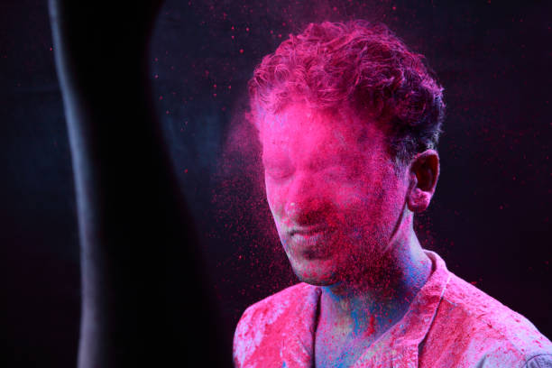 istock Young man plays Indian festival Holi 692925854