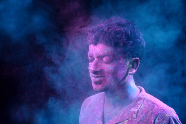 istock Young man plays Indian festival Holi 692925864