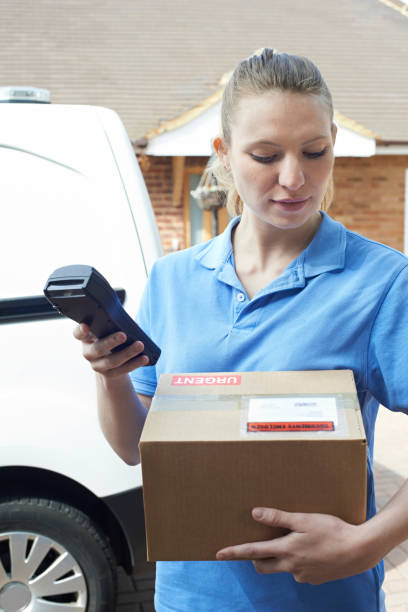 istock Female Courier Delivering Package To Domestic House 692926072