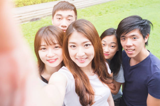 istock Group of happy friends taking a selfie 692926392