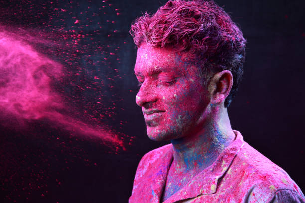 istock Young man plays Indian festival Holi 692926590