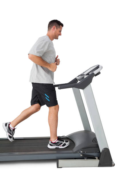 istock Full length of a young man running on a treadmill 692926646