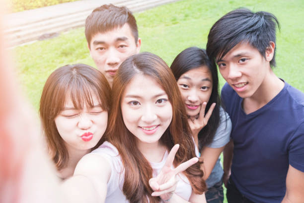 istock Group of happy friends taking a selfie 692926652