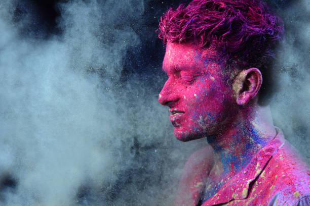 istock Young man plays Indian festival Holi 692926680