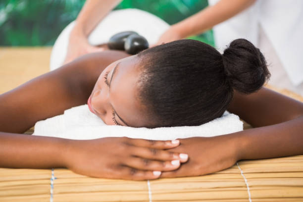 istock Pretty woman enjoying a back massage 692926990