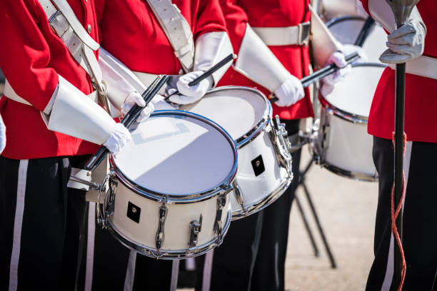 istock Soldiers on a row with drums and drumsticks 692927584