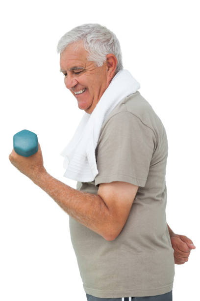 istock Side view of a senior man exercising with dumbbell 692927980