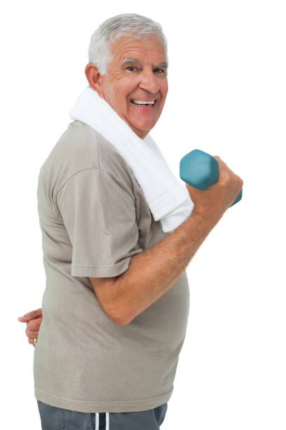 istock Side view of a senior man exercising with dumbbell 692928022