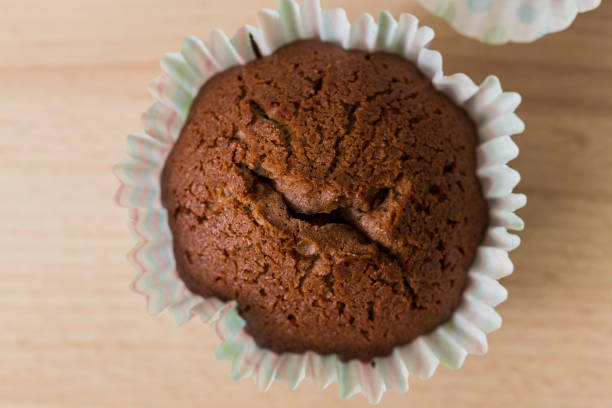 istock Isolated homemade chocolate muffin desert close up 692928110
