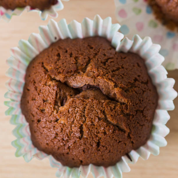 istock Isolated homemade chocolate muffin desert close up 692928160