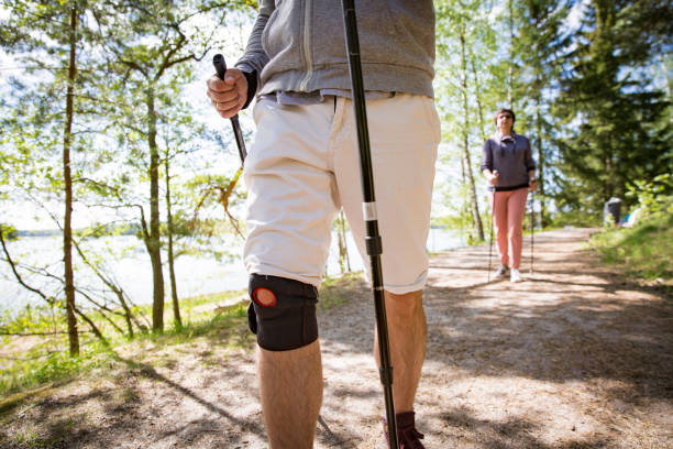 istock Man with bandage on knee, nordic walking 692931902
