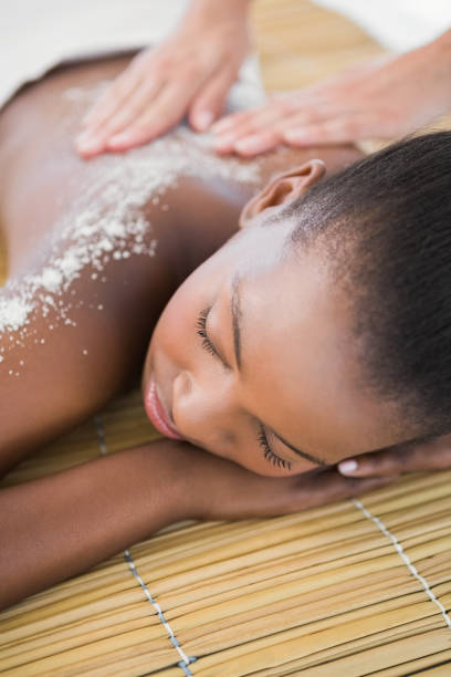 istock Pretty woman enjoying a salt scrub massage 692936822