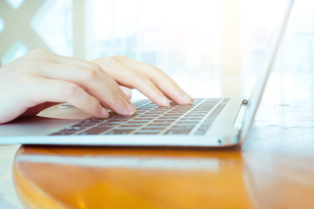 istock Close-up of hands typing on a laptop 692937264