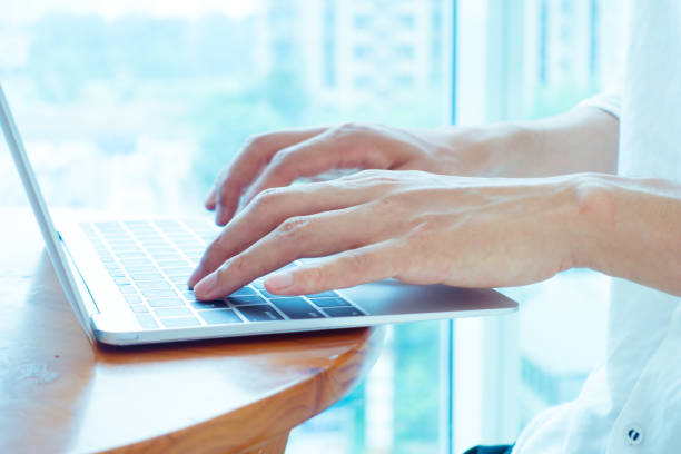 istock Businessman hands typing on laptop 692937946