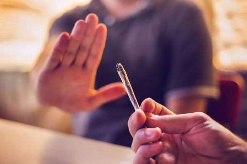 Man refusing a joint