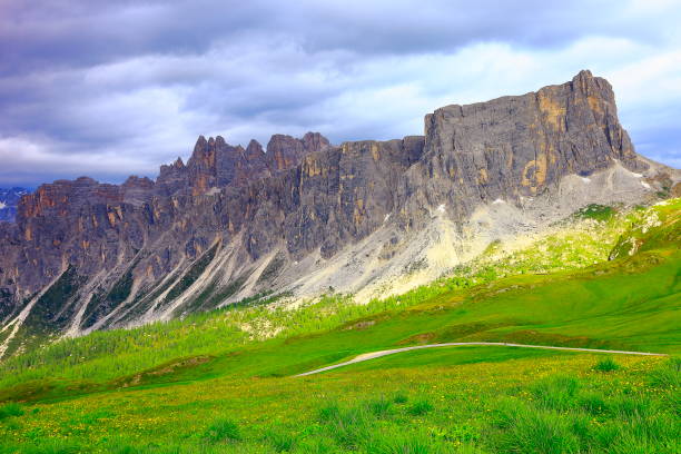 istock Passo Giau dramatic landscape, bright pinnacle and green meadows – Idyllic Mountain pass in Northern Italy Dolomites alps at sunset, near Cortina d'Ampezzo 692947754