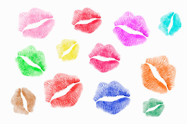 Multi-colored heart-shaped sticky notes with lipstick kisses. Pink background Valentine's day - concept. Directly above shot.