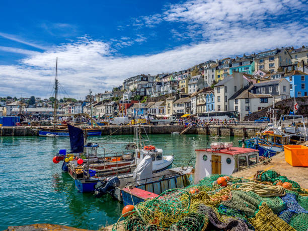 Colorful seaside village of Brixham Devon The coastal village of Brixham, Devon. devon photos stock pictures, royalty-free photos & images