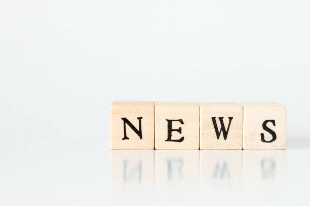 istock wooden cube written as NEWS,made with building blocks 692954658