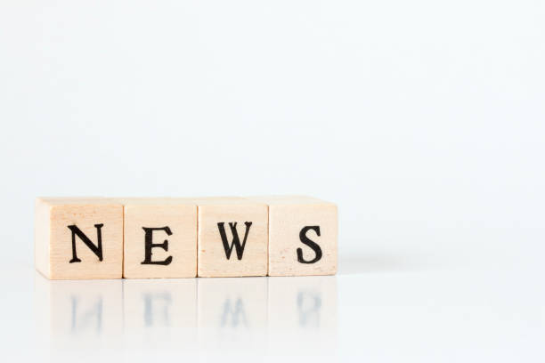 istock wooden cube written as NEWS,made with building blocks 692954662