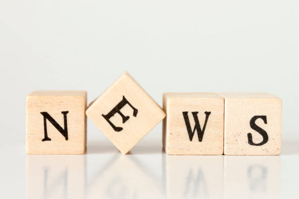istock wooden cube written as NEWS,made with building blocks 692954684