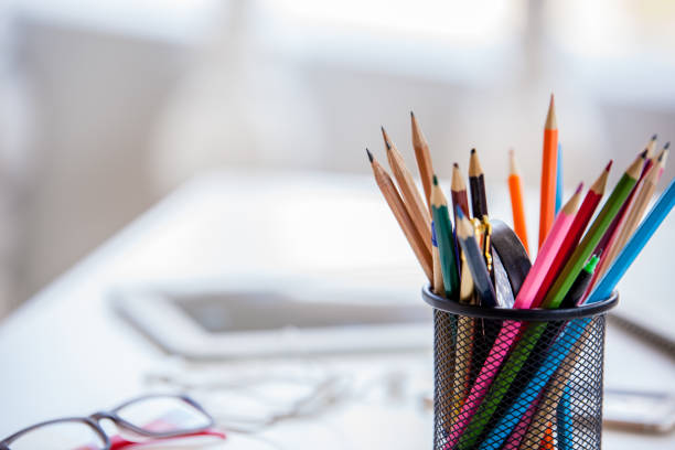 istock Office workplace with laptop, reports and pencils on wooden desk table. View with copy space 692955954