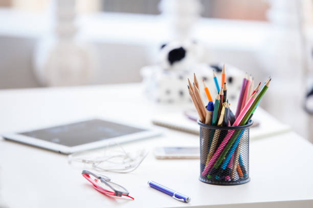 istock Office workplace with laptop, reports and pencils on wooden desk table. View with copy space 692958058